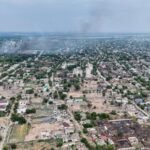 Aerial view of Oleshky on 22 September with smoke rising into the sky in the wake of an explosion.