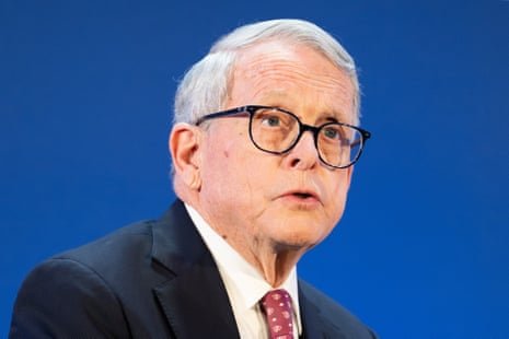 Man in front of blue background