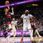 Oct 21, 2026; Washington, District of Columbia, USA; Washington Wizards guard Trae Young (3) shoots the ball as Milwaukee Bucks center Myles Turner (3) defends in the first half at Capital One Arena. Mandatory Credit: Geoff Burke-Imagn Images