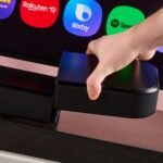 Man attaching surround speaker to the JBL Bar 800MK2