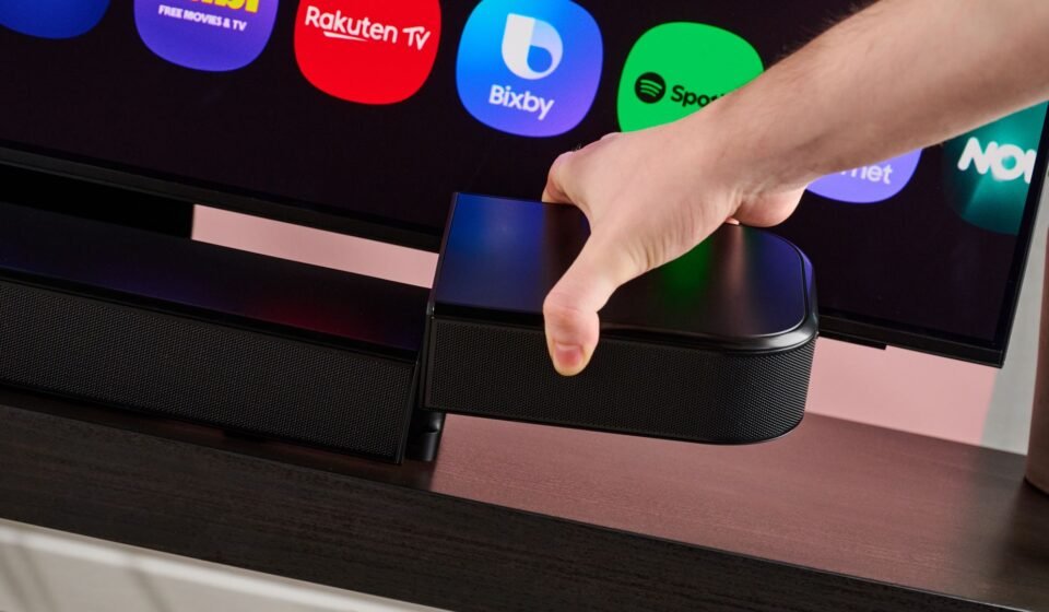 Man attaching surround speaker to the JBL Bar 800MK2