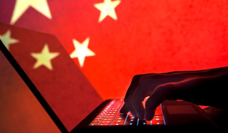 Cybercriminal, hacker China flag background.