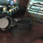 The Écoute TH2 on a wooden desk next to some equipment